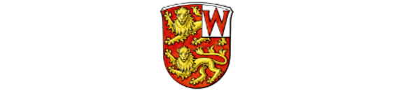 Auf dem Wehrheimer Wappen ist ein "W" zu sehen und 2 Löwen.